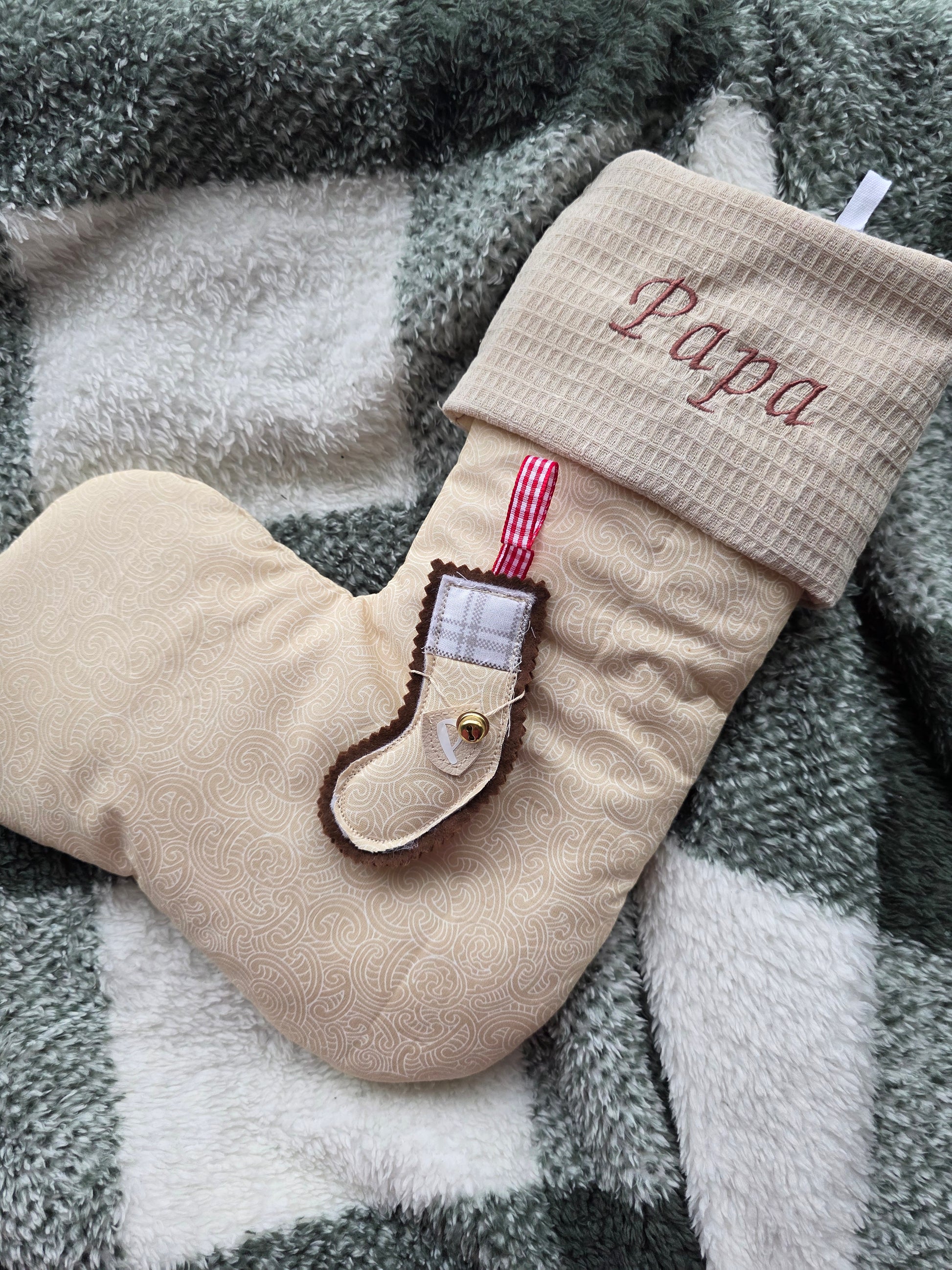 Beige koru christmas stocking