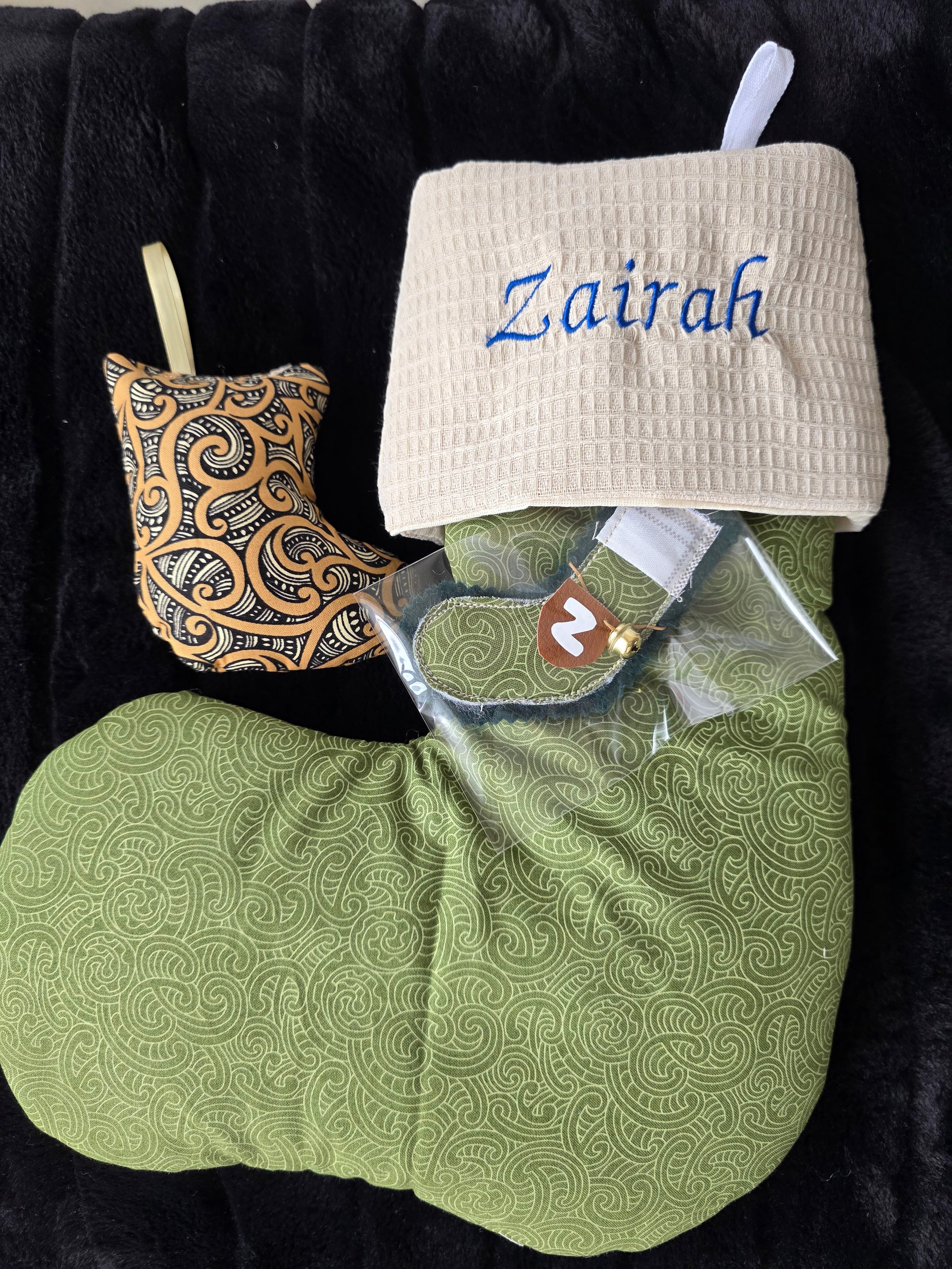 Green koru christmas stocking